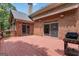 Large stained deck with a grill, brick exterior with sliding doors leading to backyard at 821 Carnellian Ln, Peachtree City, GA 30269