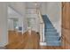 Bright foyer with hardwood floors, staircase, and views of the adjacent rooms at 821 Carnellian Ln, Peachtree City, GA 30269
