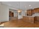 Bright kitchen featuring custom cabinets, kitchen island and hardwood floors at 821 Carnellian Ln, Peachtree City, GA 30269