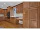 This kitchen features custom cabinets, built-in desk and hardwood floors at 821 Carnellian Ln, Peachtree City, GA 30269