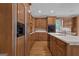 Spacious kitchen with hardwood floors, custom cabinets and stainless steel appliances at 821 Carnellian Ln, Peachtree City, GA 30269