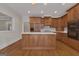 Bright kitchen with custom cabinets, island with a sink, and hardwood floors at 821 Carnellian Ln, Peachtree City, GA 30269