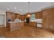 Spacious kitchen featuring custom cabinets, an island and hardwood floors at 821 Carnellian Ln, Peachtree City, GA 30269