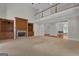 Bright living room with a fireplace, view of the second floor, and lots of space at 821 Carnellian Ln, Peachtree City, GA 30269