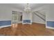 Bright living room featuring hardwood floors and open doorways at 821 Carnellian Ln, Peachtree City, GA 30269