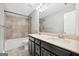 Bathroom features a double vanity, tiled shower-tub combo, and neutral color scheme at 1220 Roswell Manor Cir, Roswell, GA 30076