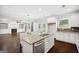 Bright kitchen showcases an island, granite countertops, and seamless flow to living area at 1220 Roswell Manor Cir, Roswell, GA 30076
