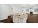 Open-concept kitchen features a spacious island with granite countertop and seating at 1220 Roswell Manor Cir, Roswell, GA 30076