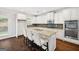 Modern kitchen with granite countertops, stainless steel appliances, and center island at 1220 Roswell Manor Cir, Roswell, GA 30076