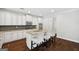 Modern kitchen features stainless steel appliances, granite countertops, and white cabinetry at 1220 Roswell Manor Cir, Roswell, GA 30076