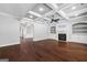 Open living space with hardwood floors, fireplace, and decorative ceilings at 1220 Roswell Manor Cir, Roswell, GA 30076
