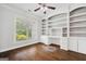 Spacious office with built-in shelving and a large window at 1220 Roswell Manor Cir, Roswell, GA 30076
