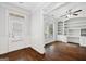 Bright office space featuring hardwood floors, built-in shelving, and ample natural light at 1220 Roswell Manor Cir, Roswell, GA 30076