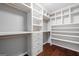 Spacious walk-in closet with custom shelving and drawers for ample storage at 1220 Roswell Manor Cir, Roswell, GA 30076