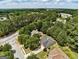 Aerial view showcasing a well-planned neighborhood with mature trees and sidewalks at 2504 Plymouth Way, Conyers, GA 30013