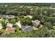 Aerial view of a residential neighborhood featuring tree-lined streets and well-kept homes at 2504 Plymouth Way, Conyers, GA 30013