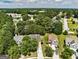 Areal view showcasing a community featuring manicured lawns and tree-lined streets at 2504 Plymouth Way, Conyers, GA 30013