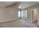 Spacious bedroom featuring a high ceiling, neutral paint, and a ceiling fan at 2504 Plymouth Way, Conyers, GA 30013