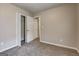 This bedroom features neutral paint, plush gray carpeting, and a closet for ample storage at 2504 Plymouth Way, Conyers, GA 30013