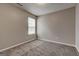 Cozy bedroom with neutral colored carpet and a window at 2504 Plymouth Way, Conyers, GA 30013