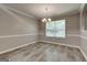 Charming dining room is complete with chandelier and lovely views at 2504 Plymouth Way, Conyers, GA 30013