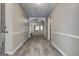 Entryway with gray walls and wood flooring, leading to arched openings and views of carpeted living spaces at 2504 Plymouth Way, Conyers, GA 30013