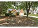 Street view of a well-maintained home, showcasing the manicured front yard and surrounding trees and neighborhood at 2504 Plymouth Way, Conyers, GA 30013