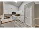 Bright kitchen with white cabinets, modern appliances, and a skylight at 2504 Plymouth Way, Conyers, GA 30013