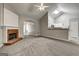 Open living room boasts a brick fireplace and flows into the kitchen at 2504 Plymouth Way, Conyers, GA 30013