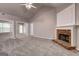 Spacious living room with neutral walls, plush carpeting, and a brick fireplace, creating a cozy atmosphere at 2504 Plymouth Way, Conyers, GA 30013