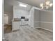Open concept with white kitchen cabinets and view of the dining room at 2504 Plymouth Way, Conyers, GA 30013