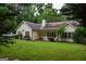 Charming home with a well-maintained lawn and mature trees at 640 Keys Ferry Rd, Mcdonough, GA 30252