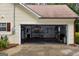 Open garage with shelving and tools, offering ample storage space at 640 Keys Ferry Rd, Mcdonough, GA 30252
