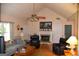 Spacious living room with a fireplace, hardwood floors, and natural light at 640 Keys Ferry Rd, Mcdonough, GA 30252