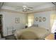 Main bedroom with a tray ceiling and comfortable furnishings at 640 Keys Ferry Rd, Mcdonough, GA 30252