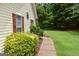 Landscaped yard and pathway on the side of the home at 640 Keys Ferry Rd, Mcdonough, GA 30252