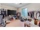 Untidy bedroom featuring wood floors and a TV at 962 Brighton Dr, Lawrenceville, GA 30043