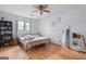 Cozy bedroom featuring wood floors, natural light, and a ceiling fan at 962 Brighton Dr, Lawrenceville, GA 30043