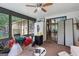 Bright sunroom with lots of windows and a ceiling fan at 962 Brighton Dr, Lawrenceville, GA 30043