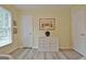 Bedroom with a wood floor, a window, and white walls at 210 Grandchester Way, Fayetteville, GA 30215