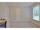 Bedroom featuring a desk with drawers and large window, providing ample natural light at 210 Grandchester Way, Fayetteville, GA 30215