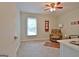 Spacious bedroom includes a comfortable chair, ceiling fan, and plenty of natural light at 210 Grandchester Way, Fayetteville, GA 30215