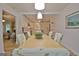 Open dining area with a view to the kitchen featuring updated lighting at 210 Grandchester Way, Fayetteville, GA 30215