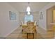 Bright dining room featuring a wooden table and floral upholstered chairs at 210 Grandchester Way, Fayetteville, GA 30215