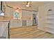 Stylish kitchen featuring stainless steel appliances, white cabinets, and backsplash at 210 Grandchester Way, Fayetteville, GA 30215