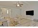 Spacious living room features an open floor plan and wood floors at 210 Grandchester Way, Fayetteville, GA 30215