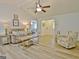 Open living room with wood floors and a comfortable seating area at 210 Grandchester Way, Fayetteville, GA 30215