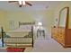 Comfortable main bedroom with carpet floor, with a dresser, mirror, and side table at 210 Grandchester Way, Fayetteville, GA 30215