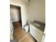 Bathroom with granite countertops and an open doorway to storage room at 11598 E Lovejoy Rd # 3, Hampton, GA 30228