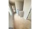 Bright hallway featuring neutral walls and doorways leading to various rooms in the home at 11598 E Lovejoy Rd # 3, Hampton, GA 30228
